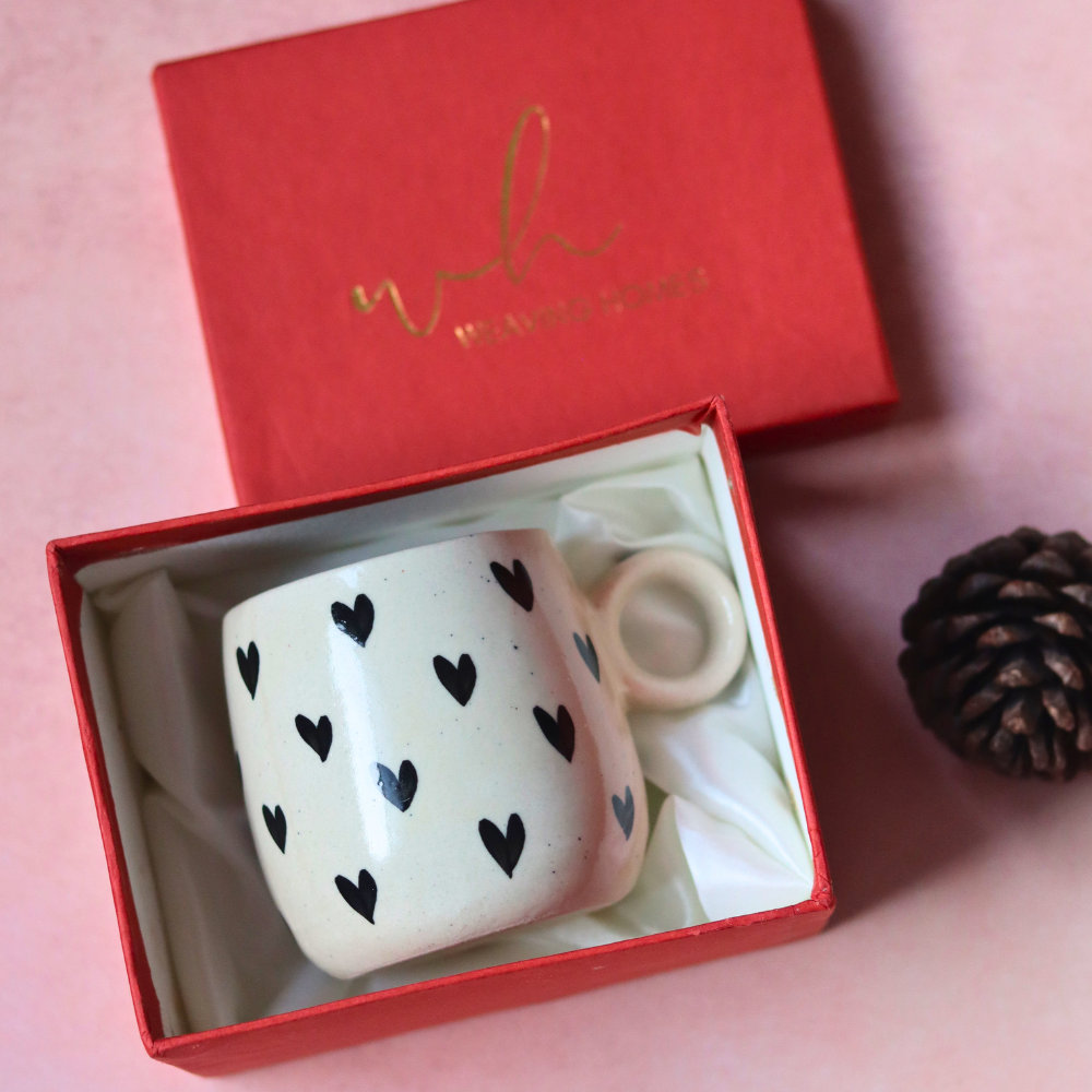 Black heart cuddle mug in a red gift box