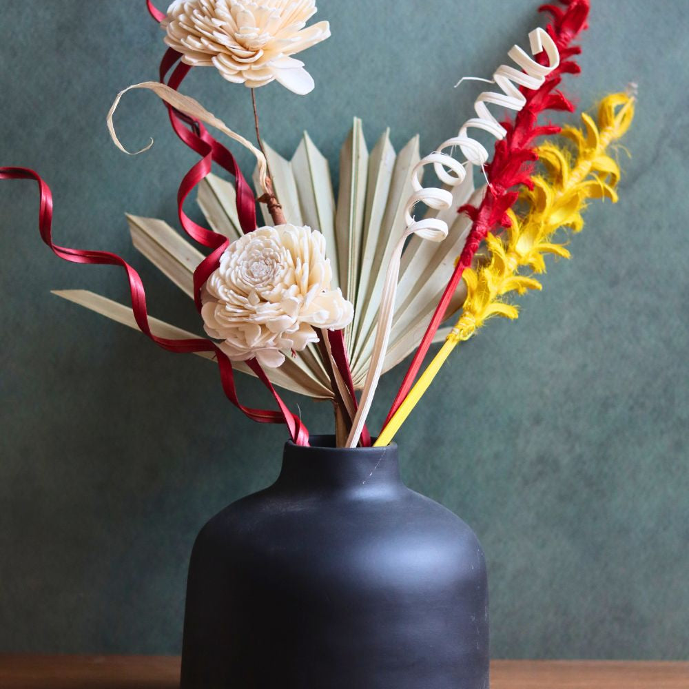 Handmade black round vase with assorted bunch combo