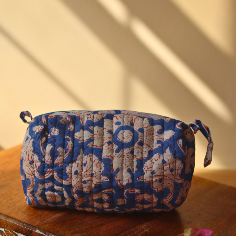 blue floral toiletry bag small size on wooden surface