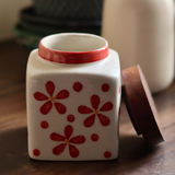 red flower jar made by ceramic 