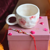 Floral Bliss Mug in a Gift box with Rakhi made by ceramic