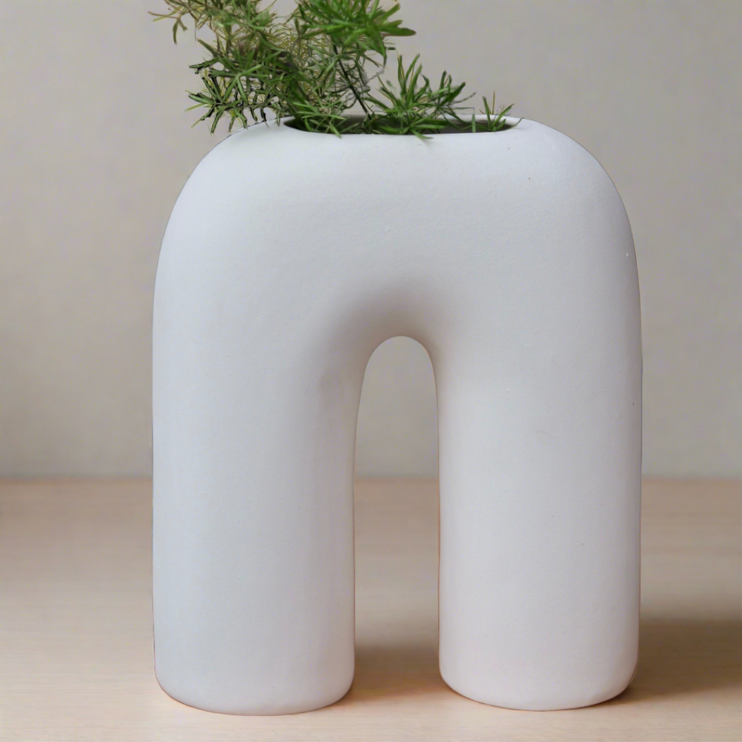 Handmade ceramic white leg vase with plant 