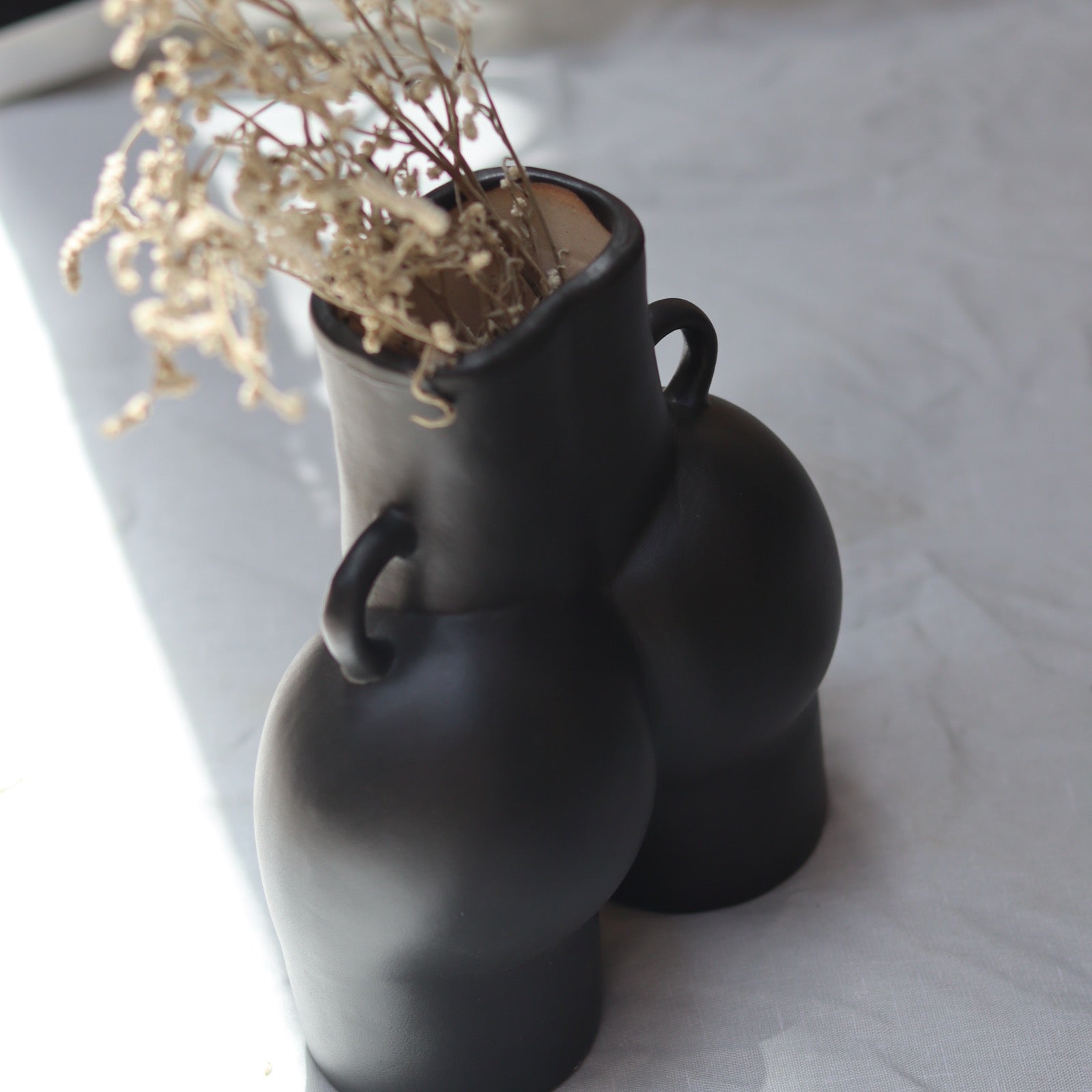 Body vase with flowers