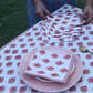 white table napkin with red floral print 