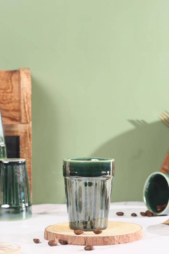 Green kulhad on wooden surface