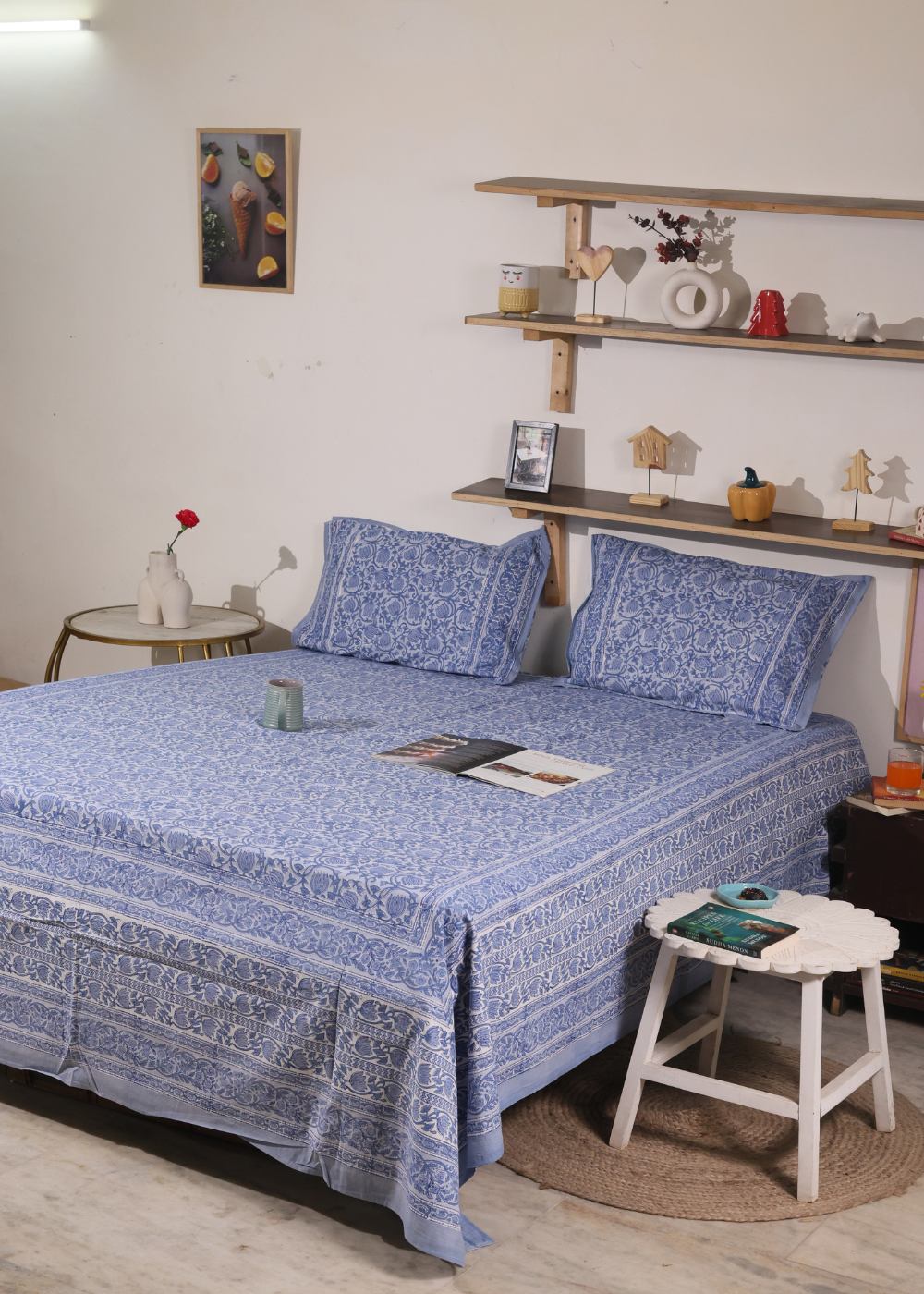 A systematic room and bed with blue lotus block printed bedsheet