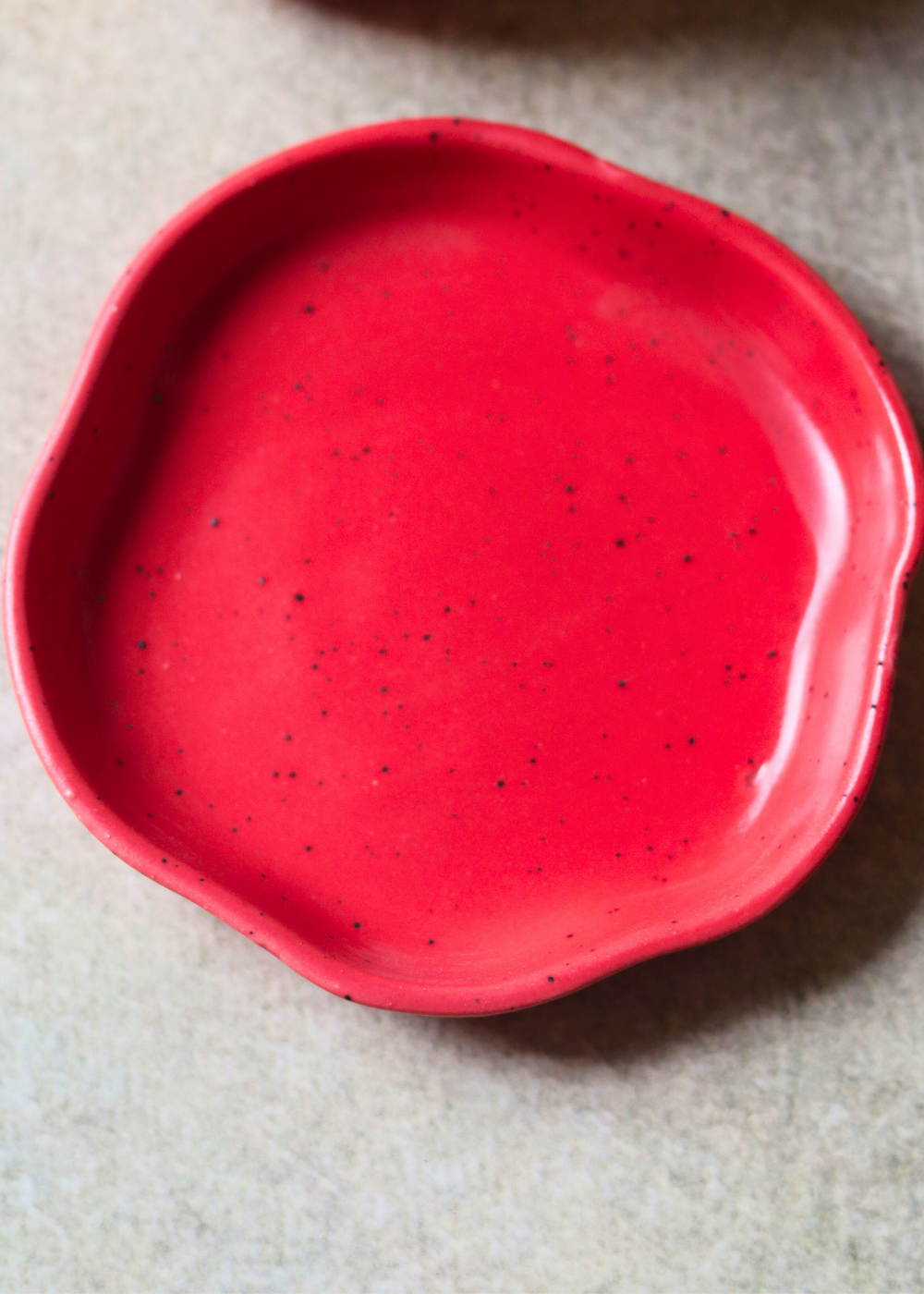 red handmade dessert plate made by ceramic 