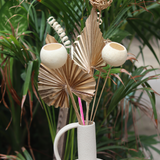 Dry flowers in white vase 