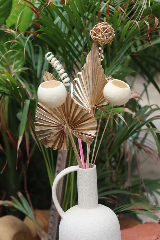 Dry flowers in white vase 