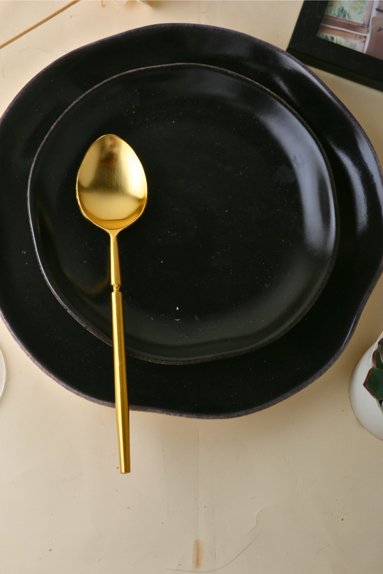 Golden tranquility dinner spoon with plate