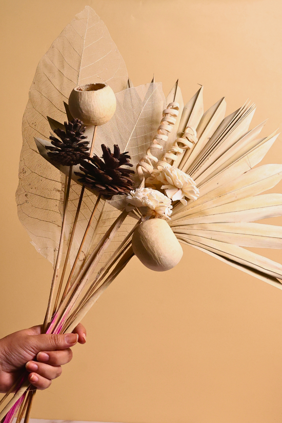 Natural dried flower bouquet in hand 