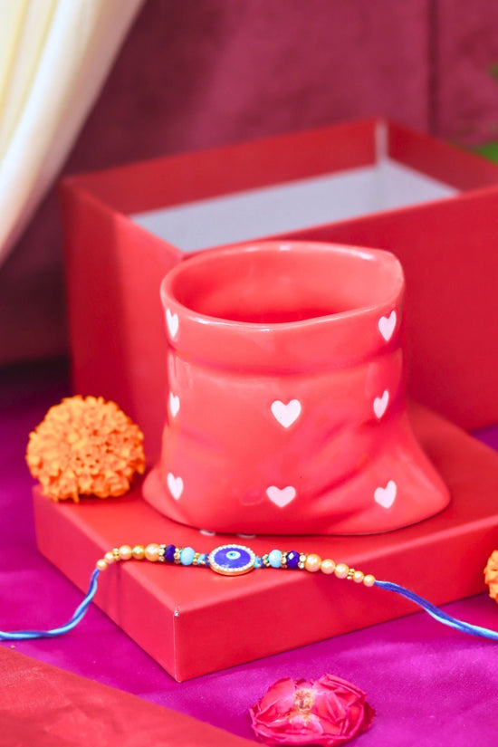 Red Heart Pouch Mug Rakhi gift box made by ceramic