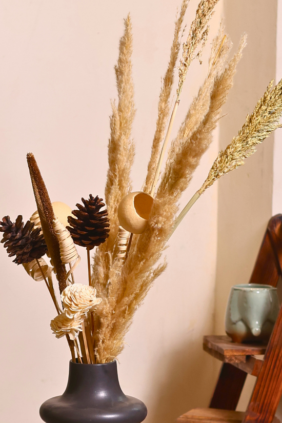 Black flower vase with different bunches