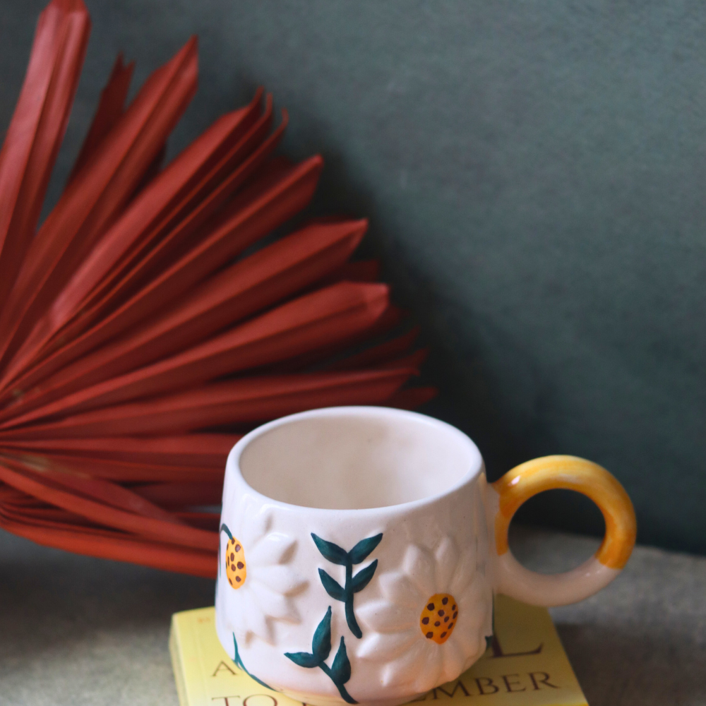 Daisy Bloom Coffee Mug On Book