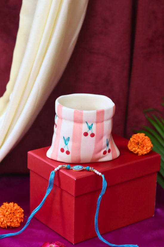 Striped Pouch Mug Rakhi gift box made by ceramic