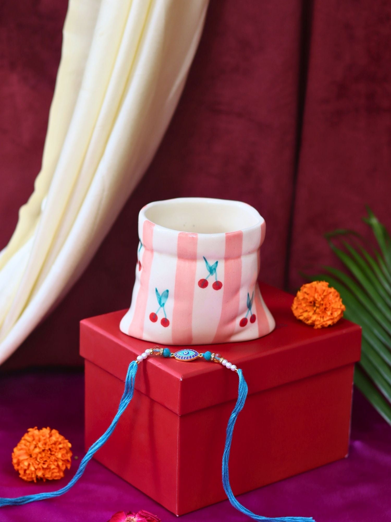 Striped Pouch Mug Rakhi gift box made by ceramic