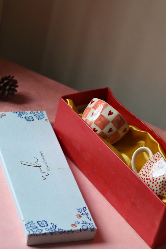 Handmade ceramic coffee mugs in a box