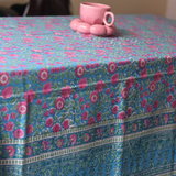 Handmade table cloth with cup & saucer on it