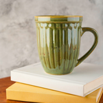 moss green mug with adorable design 