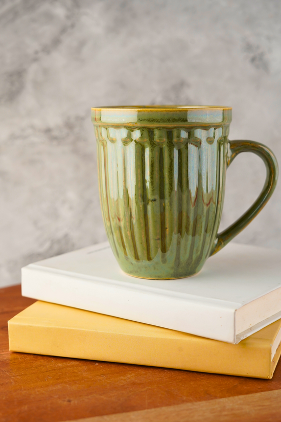 moss green mug with adorable design 