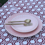 Handprinted table cloth with dishes 