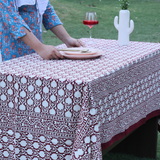 Maroon table cloth on table 