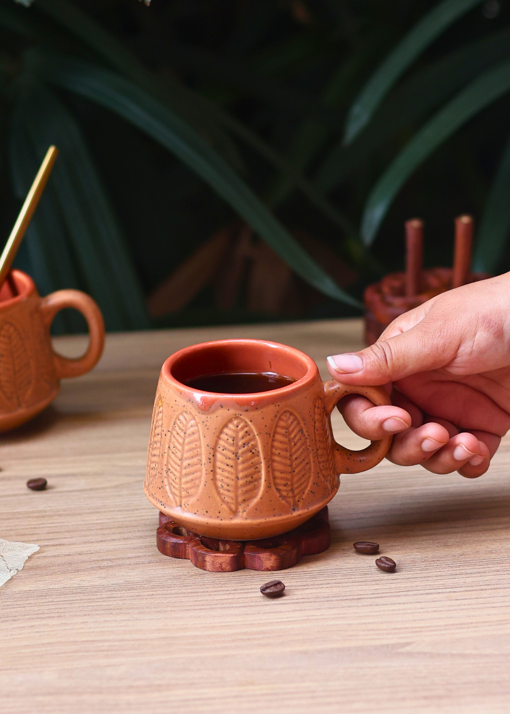 Handmade coffee mug in hand