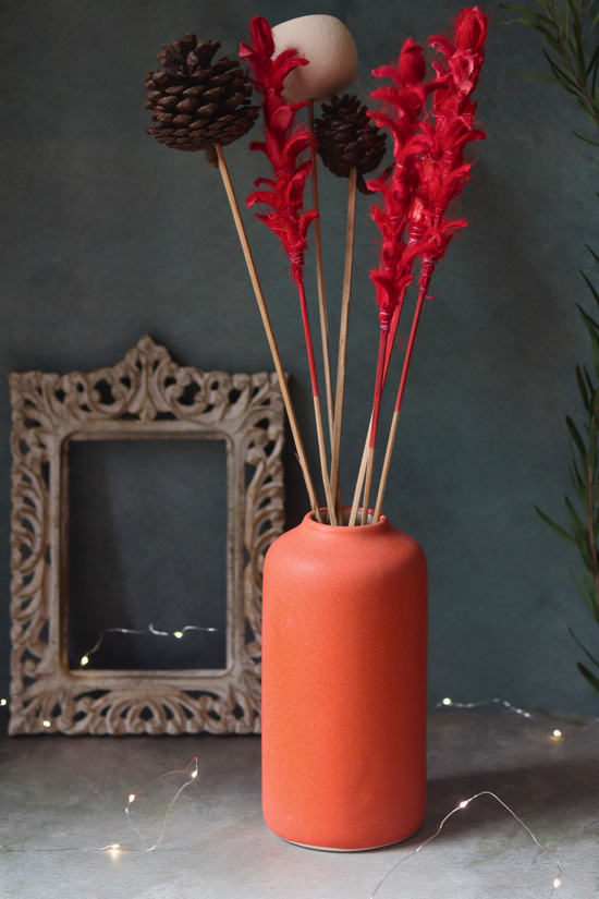 Orange bloom ceramic flower vase with flowers