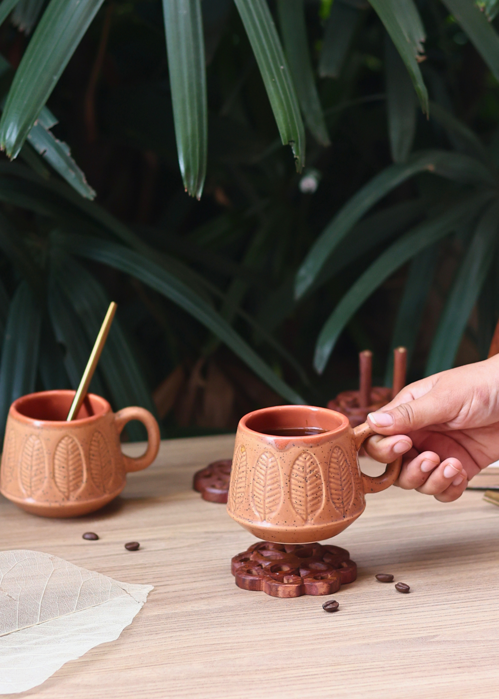 ceramic coffee mug in hand