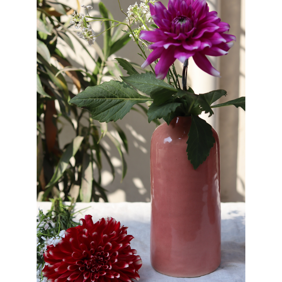 pink tall vase made by ceramic 