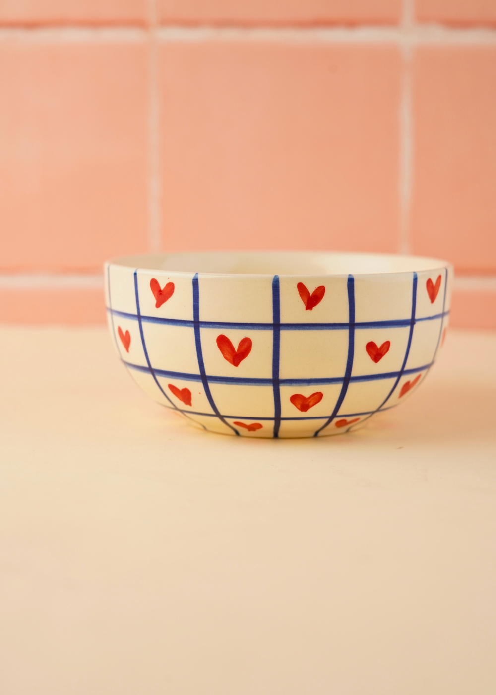 blue chequered heart bowl made by ceramic  
