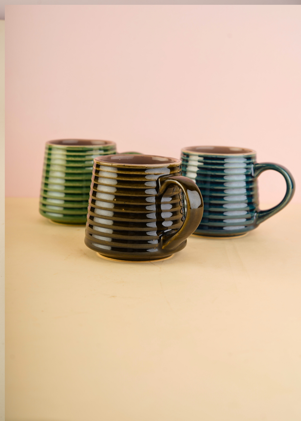 three mugs with striped design