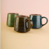 three mugs with striped design