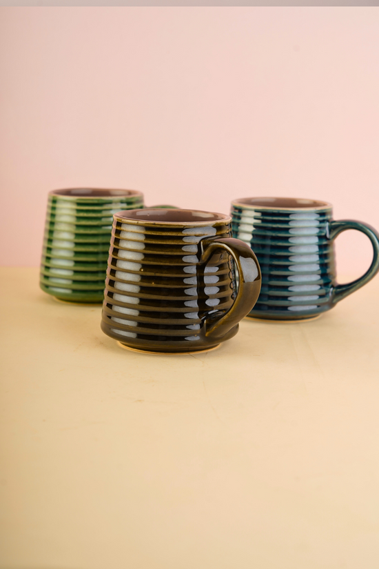 three mugs with striped design