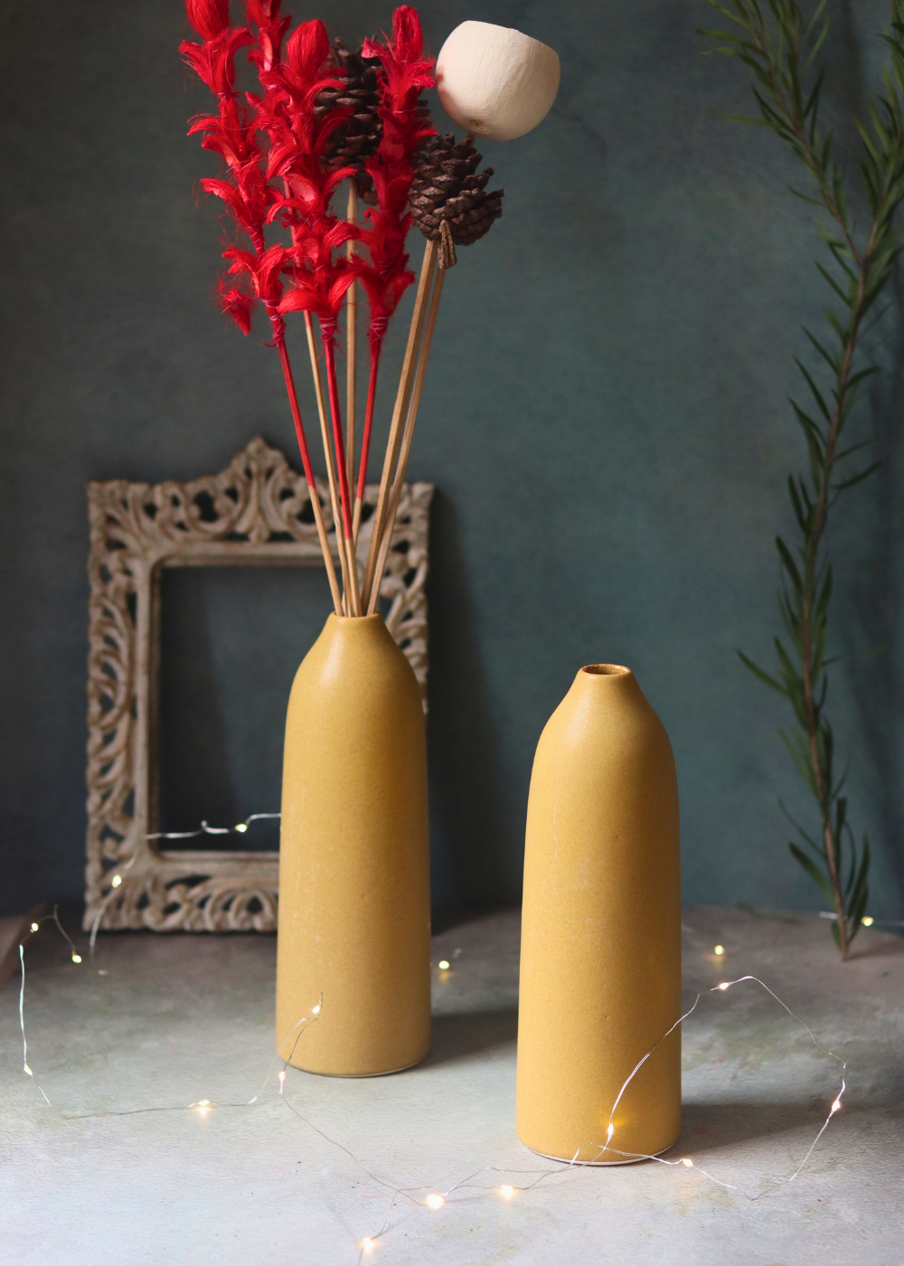 Two ceramic flower vases with flowers