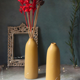 Two ceramic flower vases with flowers