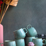 handmade teal chai cups with delicious dessert