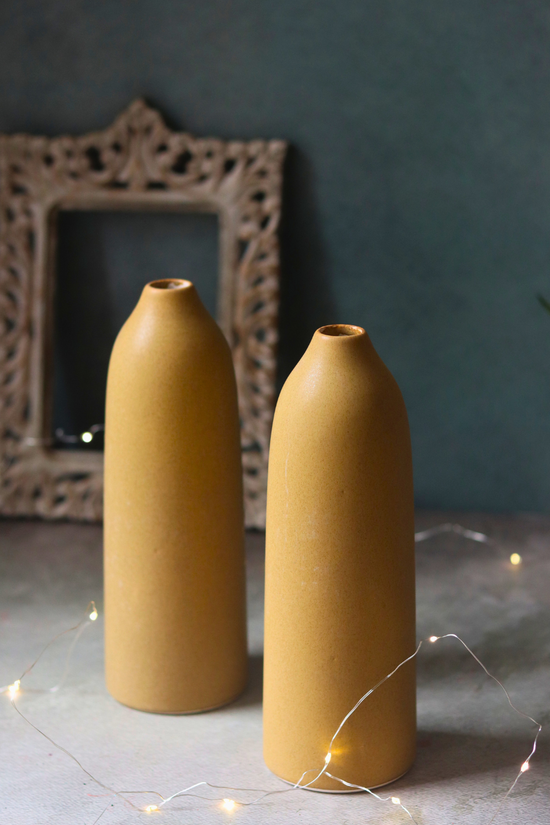Two ceramic tall brown vases 