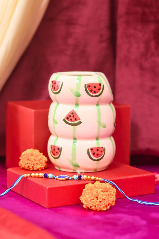 Melon Sipper with Rakhi Gift box made by ceramic