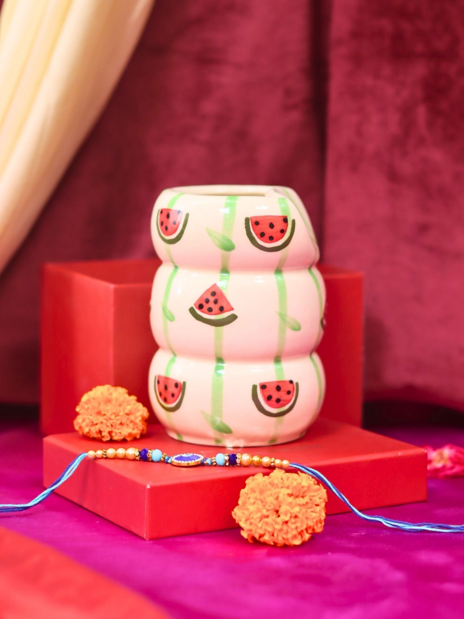 Melon Sipper with Rakhi Gift box made by ceramic