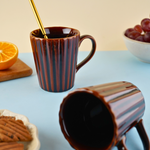 brown coffee mug with ceramic material