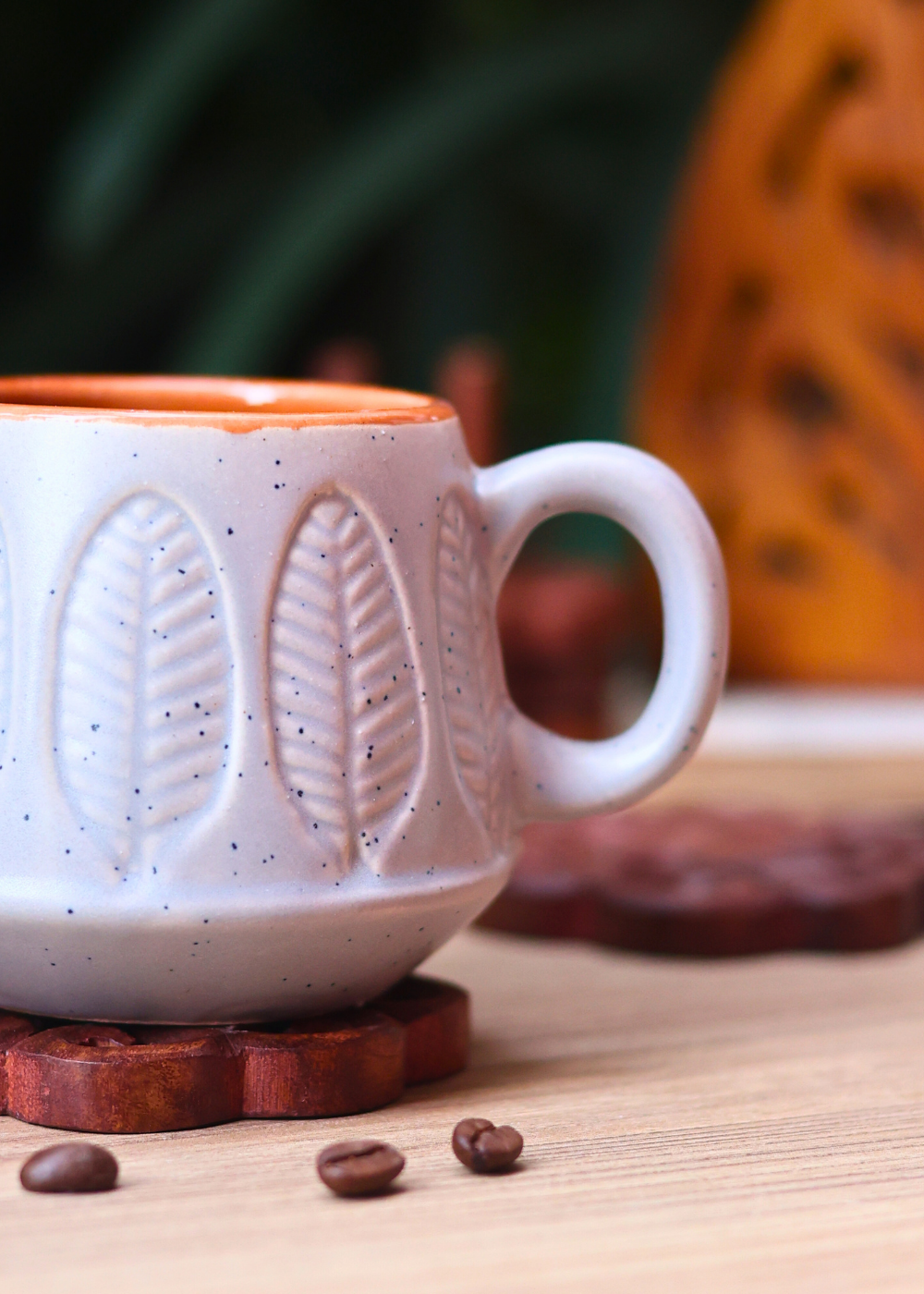 Closeup shot of grey serene leaf coffee mug