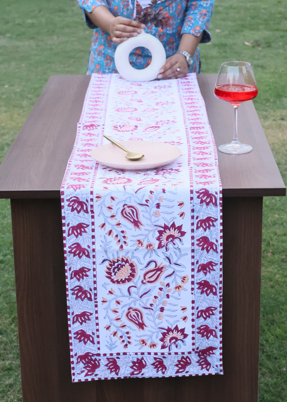 Intricate design table runner on table 