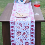 Intricate design table runner on table 