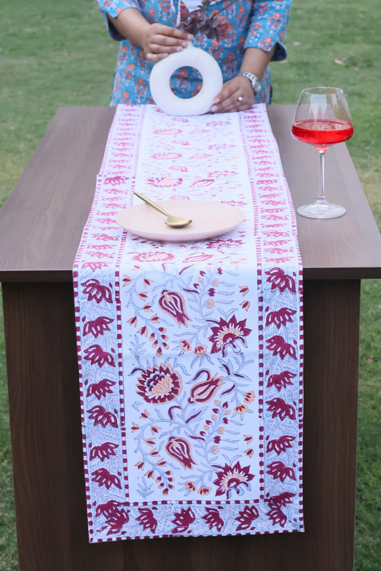 Intricate design table runner on table 