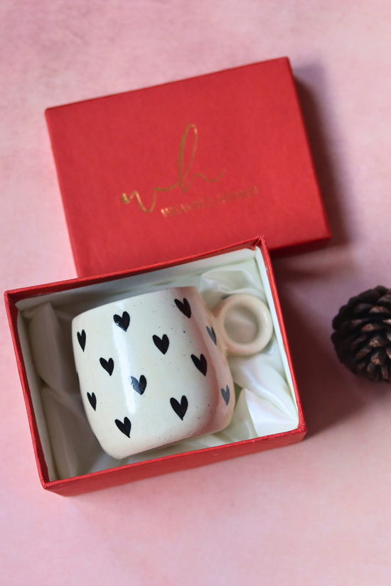 Black heart cuddle mug in a red gift box