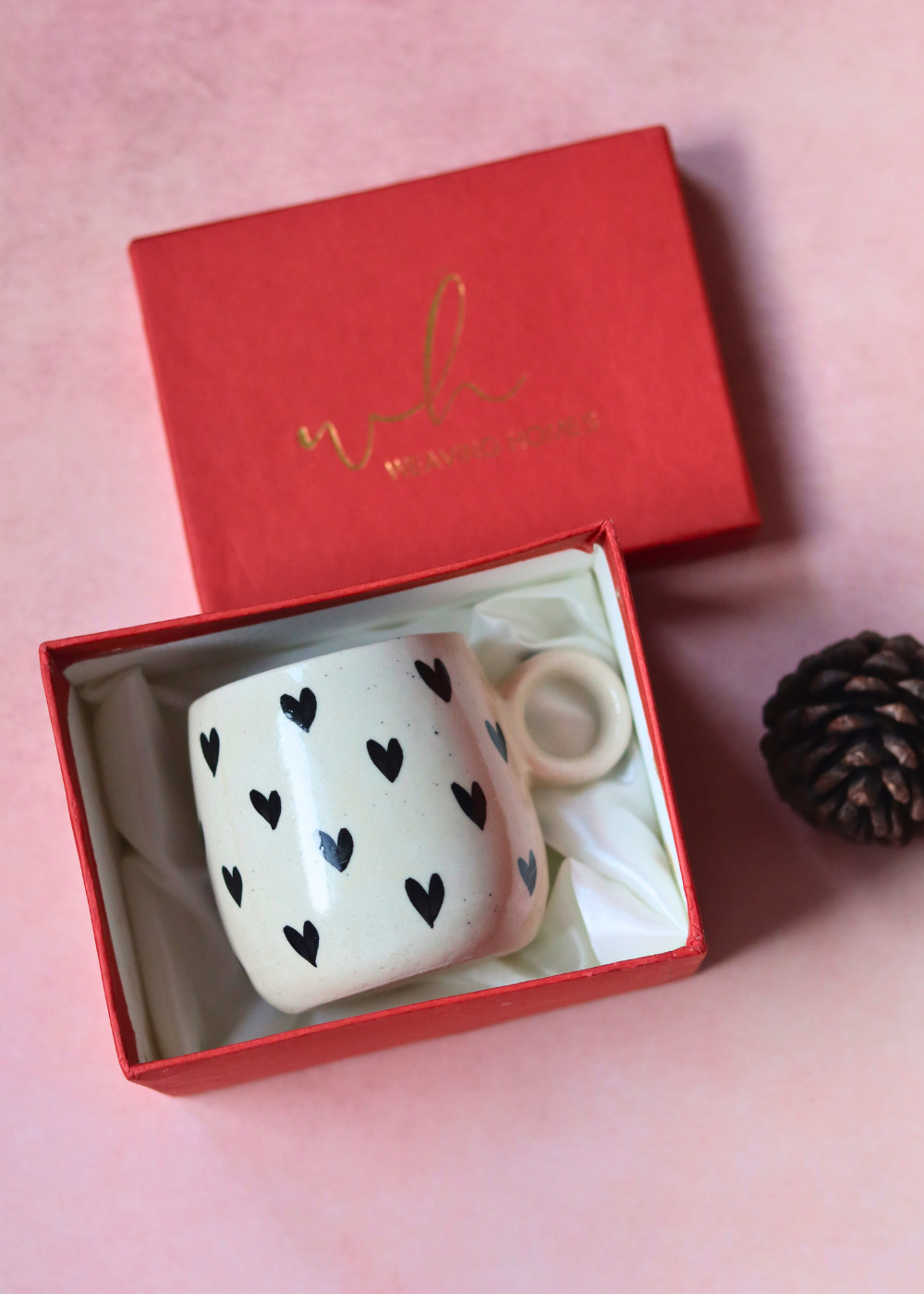 Black heart cuddle mug in a red gift box