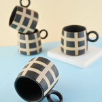 black checkered Mug with ceramic material