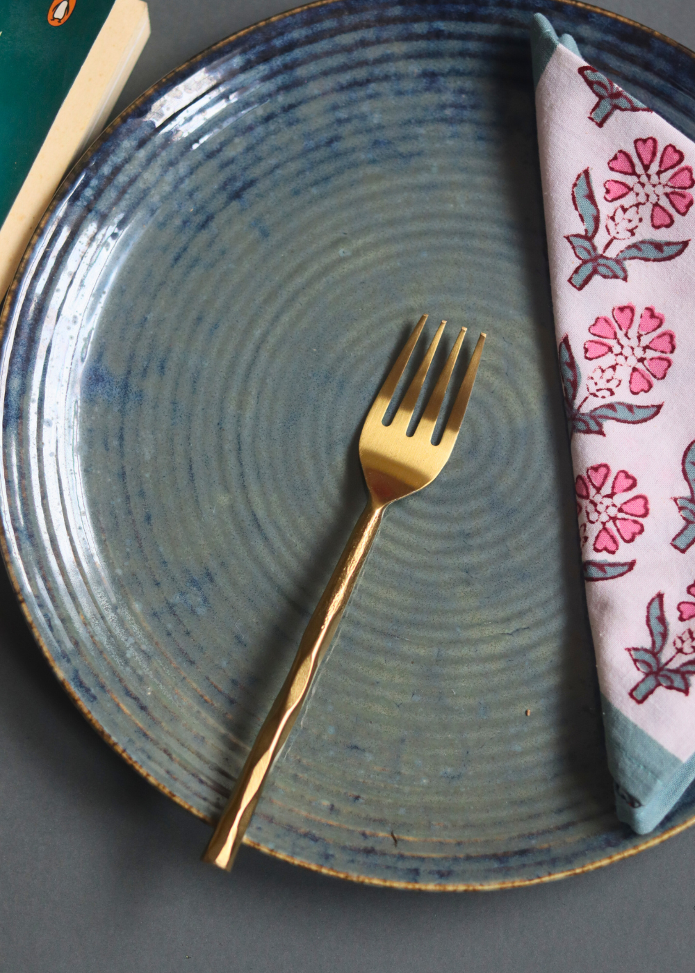 Gold hammered mini fork on plate 