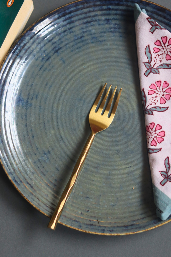 Gold hammered mini fork on plate 